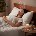 Woman relaxing in spa-like bedroom wearing the Heated Steam Eye Mask