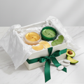 Gold and avocado eye patches in luxury gift box with ribbon